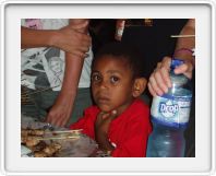 Young customer at the food stalls