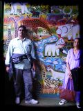 Veena's brother Amar and mom framed against a Tinga Tinga painting